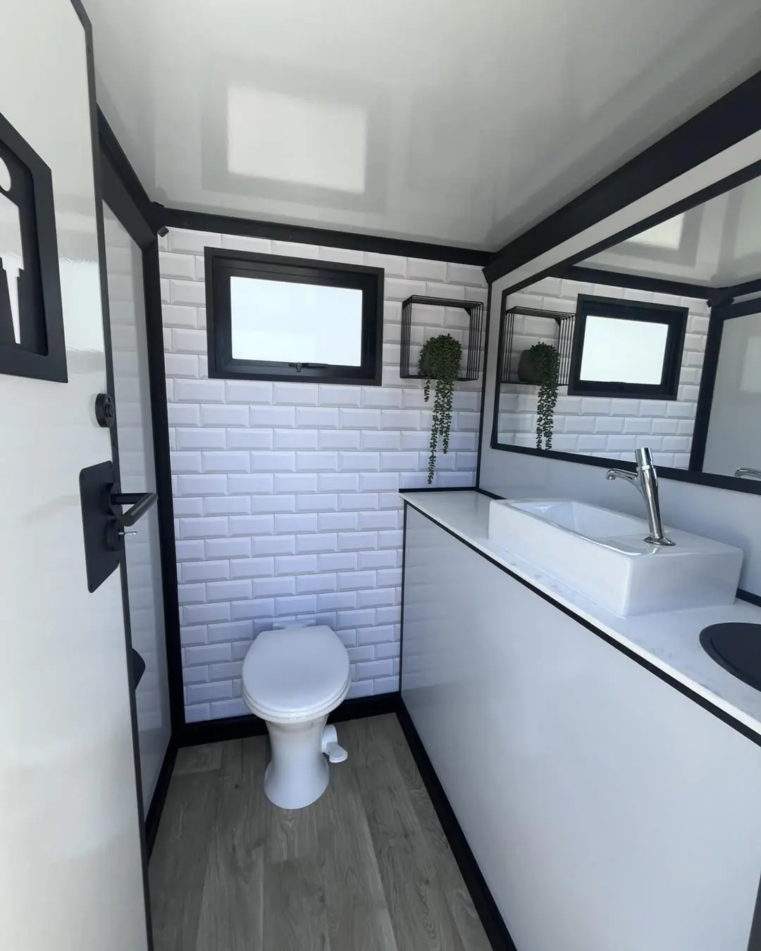 Flush toilet and vanity in a trailer