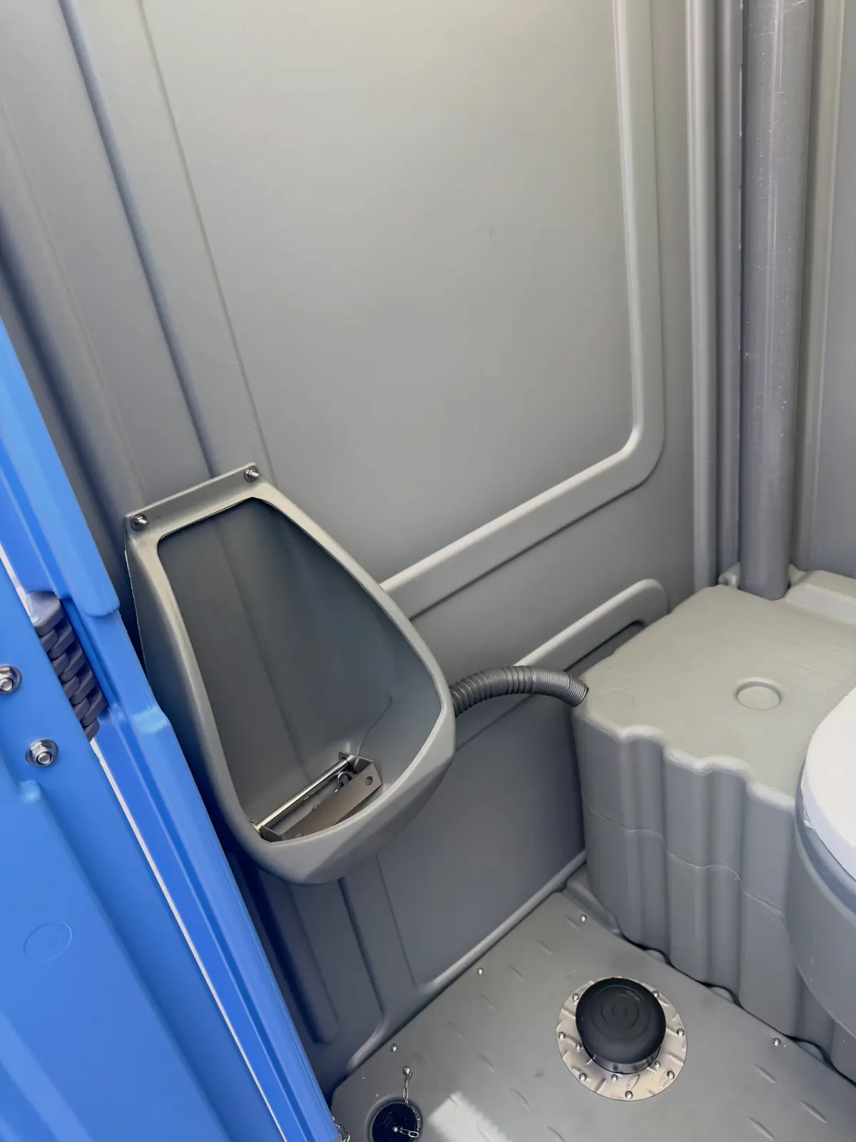 Urinal inside a standard unit, cleaned and sanitized