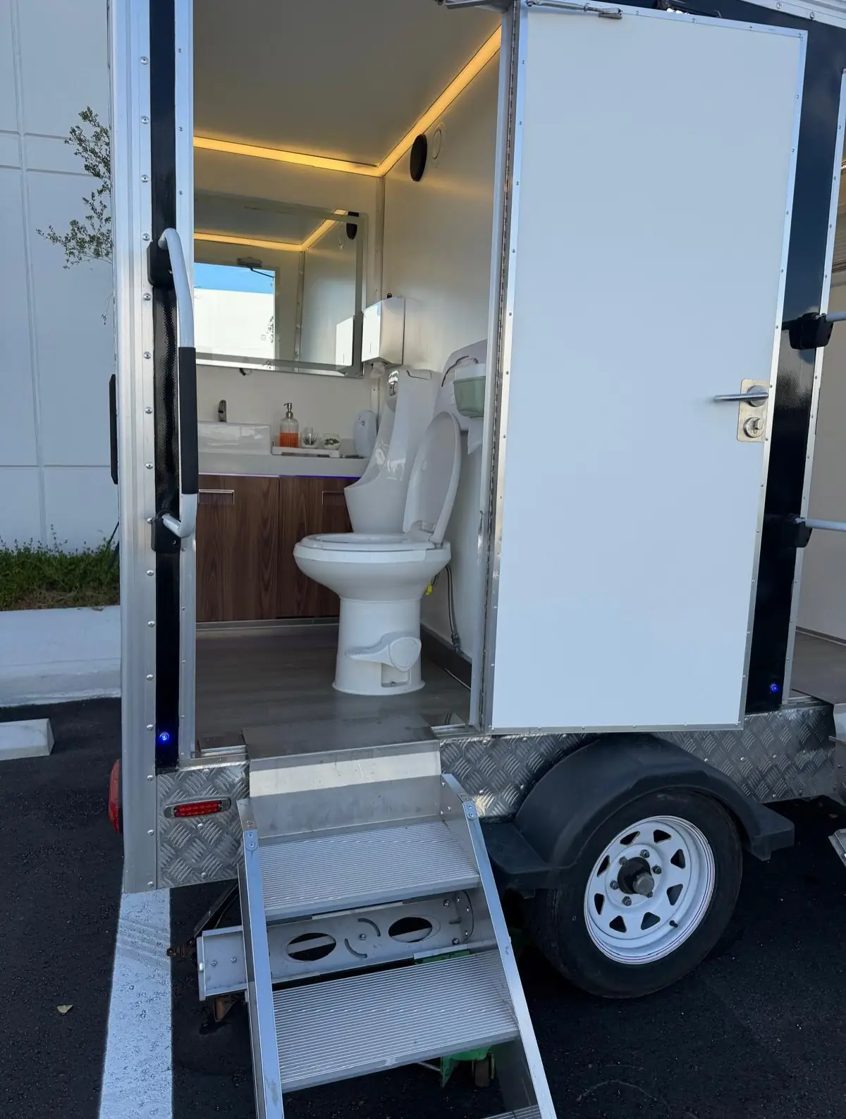Open door showing the flush toilet