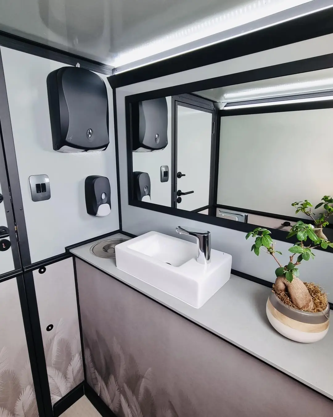 Trailer vanity with sink and mirror